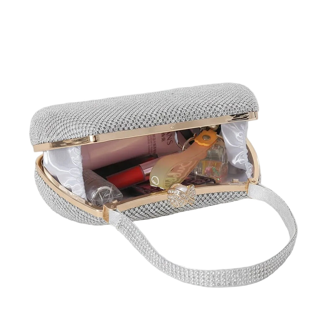 BagHalo silver rhinestone clutch handbag with gold trim, adjustable strap, and interior pockets. Perfect for evening events.