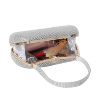 BagHalo silver rhinestone clutch handbag with gold trim, adjustable strap, and interior pockets. Perfect for evening events.