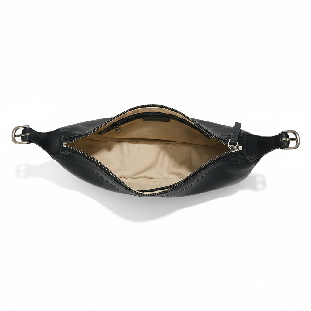 Black leather waist bag with gold zipper on a light gray background